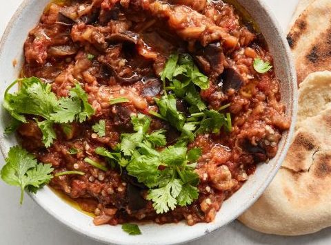 Here’s a recipe for Zaalouk, a delicious Moroccan eggplant and tomato salad, known for its smoky flavor and rich spices. It's a great side dish or appetizer. Ingredients: 2 large eggplants (aubergines), peeled and cut into cubes 4 large tomatoes, peeled and diced 1 onion, finely chopped 3 cloves garlic, minced 2 tablespoons olive oil 1 teaspoon ground cumin 1 teaspoon paprika 1/2 teaspoon ground turmeric 1/2 teaspoon ground cinnamon (optional) Salt and pepper to taste 1/4 teaspoon chili flakes or a fresh chili (optional, for heat) 1/2 cup fresh parsley, chopped 1/4 cup fresh cilantro, chopped 1 tablespoon lemon juice 1 tablespoon vinegar (optional, for tanginess) Instructions: Prepare the Eggplant: Heat a grill or griddle pan over medium heat. Once hot, place the cubed eggplants on the grill and cook them for 10-15 minutes, turning occasionally until they become tender and develop a smoky flavor. If you don’t have a grill, you can roast the eggplant in the oven at 400°F (200°C) for 25-30 minutes or sauté them in olive oil until soft. Once cooked, set the eggplant aside to cool slightly. Cook the Tomatoes and Onion: In a large pan, heat the olive oil over medium heat. Add the chopped onion and garlic, and sauté for 3-4 minutes until softened and fragrant. Add the diced tomatoes, cumin, paprika, turmeric, cinnamon (if using), chili flakes (if using), salt, and pepper. Stir and cook for 10 minutes, letting the tomatoes break down and form a thick sauce. Combine the Ingredients: Once the tomatoes have softened and the mixture has thickened, add the grilled or roasted eggplant to the pan. Mix well and let it cook for another 5-10 minutes, allowing the flavors to meld together. Finishing Touches: Remove the pan from the heat and stir in the fresh parsley, cilantro, lemon juice, and vinegar (if using). Adjust seasoning to taste, adding more salt, pepper, or lemon juice if needed. Serve: Serve the Zaalouk warm or at room temperature with Moroccan bread (khobz), pita, or as a side to your main meal. It can also be enjoyed as a dip. Tips: Smoky Flavor: If you want to enhance the smoky flavor, you can roast the eggplants directly over an open flame (on a gas stove) or grill them. Chill: Zaalouk can be made ahead of time and kept in the fridge. It often tastes better the next day as the flavors develop more. Zaalouk is a wonderfully flavorful and healthy dish with the combination of smoky eggplant, tangy tomatoes, and fragrant spices. It’s a great way to enjoy vegetables with a Moroccan twist!