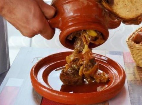 Here's a recipe for Tangia, a traditional Moroccan slow-cooked dish from Marrakech, typically made with lamb or beef. It’s cooked in a clay pot (called a "tangia"), giving the meat a tender texture and rich flavor. Ingredients: 2 lbs (900 g) lamb (shoulder or shank), cut into large chunks 2 tablespoons olive oil 1 large onion, chopped 4 cloves garlic, minced 1 teaspoon ground cumin 1 teaspoon ground coriander 1 teaspoon paprika 1 teaspoon ground ginger 1/2 teaspoon ground cinnamon 1/2 teaspoon turmeric Salt and pepper to taste 1/4 teaspoon saffron threads (optional) 1 preserved lemon, peeled, seeded, and cut into quarters 1/4 cup fresh parsley, chopped 1/4 cup fresh cilantro, chopped 1 cup water or beef broth 2 tablespoons raisins (optional) 1/4 cup almonds, toasted (optional) 1 tablespoon butter (optional, for extra richness) Instructions: Prepare the Meat: In a large bowl, rub the lamb pieces with olive oil, minced garlic, cumin, coriander, paprika, ginger, cinnamon, turmeric, salt, and pepper. Let it marinate for at least an hour (or overnight for the best flavor). Preheat the Tangia Pot: If using a traditional Moroccan tangia pot, preheat it in your oven at 325°F (165°C). Alternatively, you can use a Dutch oven or any large, heavy pot that can be covered. Cook the Lamb: Heat some olive oil in a large pan over medium heat. Brown the lamb chunks on all sides to seal in the flavor, about 5-7 minutes. Once browned, transfer the lamb to the tangia or pot. Add the chopped onion, saffron (if using), preserved lemon, fresh parsley, and cilantro. Pour in the water or beef broth and stir to combine. Slow-Cook the Tangia: Cover the pot with a lid and cook in the oven for about 2-3 hours or until the meat is fork-tender and the flavors have melded together. If you're using a tangia pot, you can also cook it in a traditional Moroccan oven or a slow-cooking method over hot coals. During the last 30 minutes, you can add raisins to give a sweet contrast to the savory flavors. Finish and Serve: After the lamb is cooked and tender, remove the pot from the oven. Stir in the toasted almonds and butter for richness if desired. Serve the tangia with Moroccan bread (khobz) or couscous to soak up the flavorful sauce. Tips: For added depth of flavor: If you have access to a traditional tangia pot, it will give the dish a smoky, unique taste that’s hard to replicate with modern cooking vessels. Optional vegetables: You can add vegetables like carrots or potatoes into the pot for a one-pot meal. Tangia is an unforgettable Moroccan dish with tender, aromatic meat and a rich broth. The preserved lemon, saffron, and spices create a balanced, delicious flavor that’s perfect for family gatherings or a special occasion.